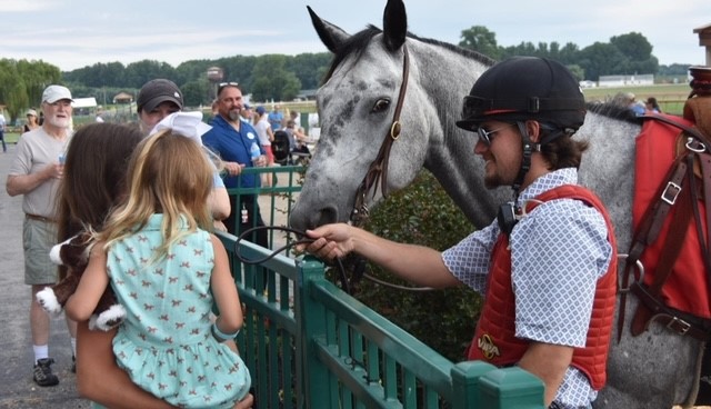 Horse meeting with fans after a race