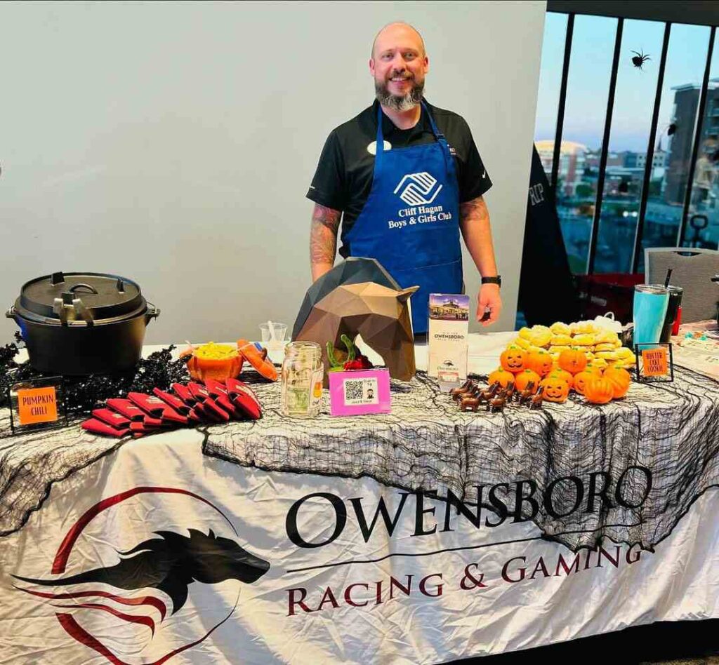 Owensboro Racing & Gaming team member setup at a booth for a Cliff Hagan Boys & Girls Club event