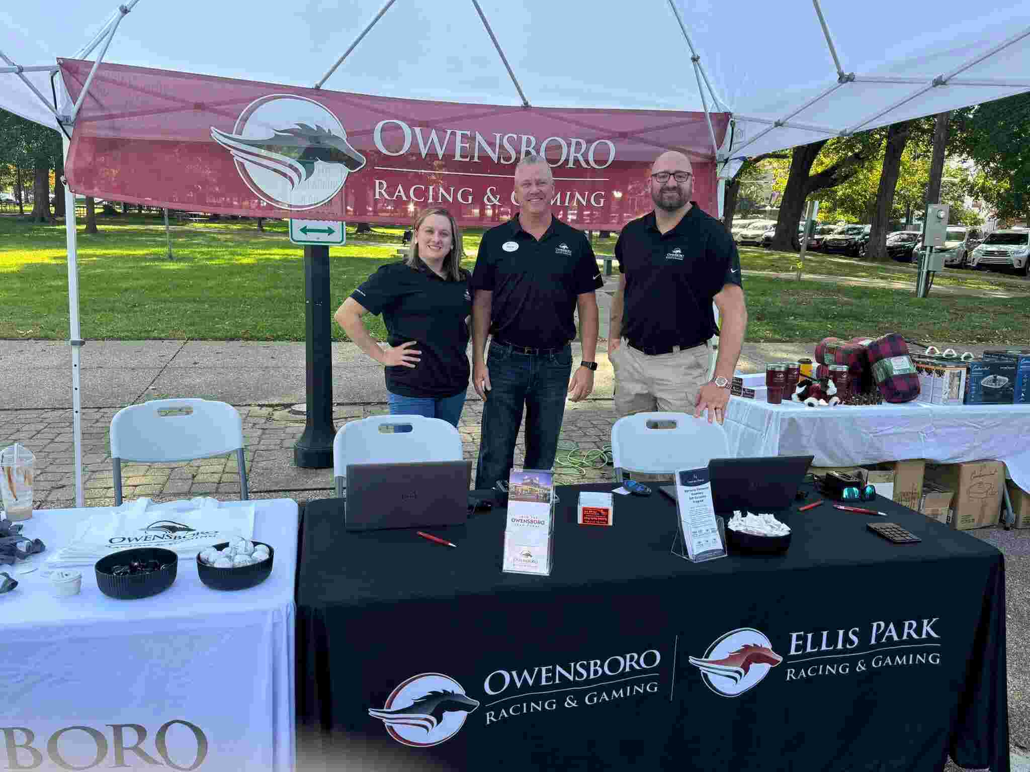 Owensboro Racing & Gaming team members setup at a booth for a community event